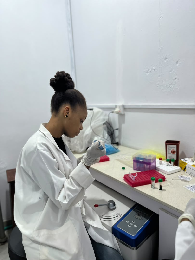 Researcher preparing samples at the bench